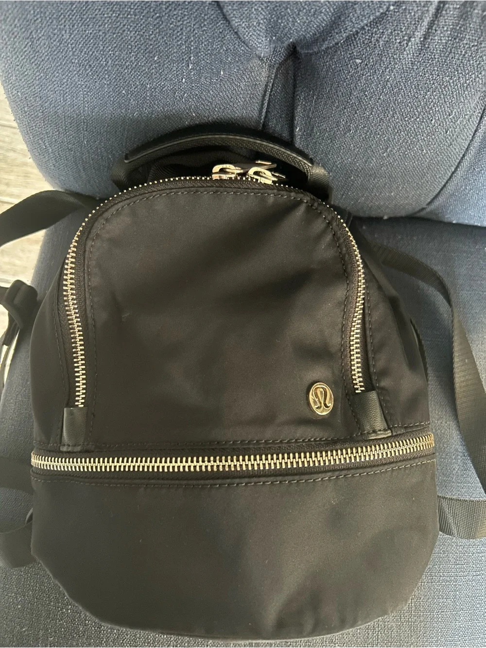 Lululemon City Adventurer Backpack Micro 3L in Black with Gold hardware.